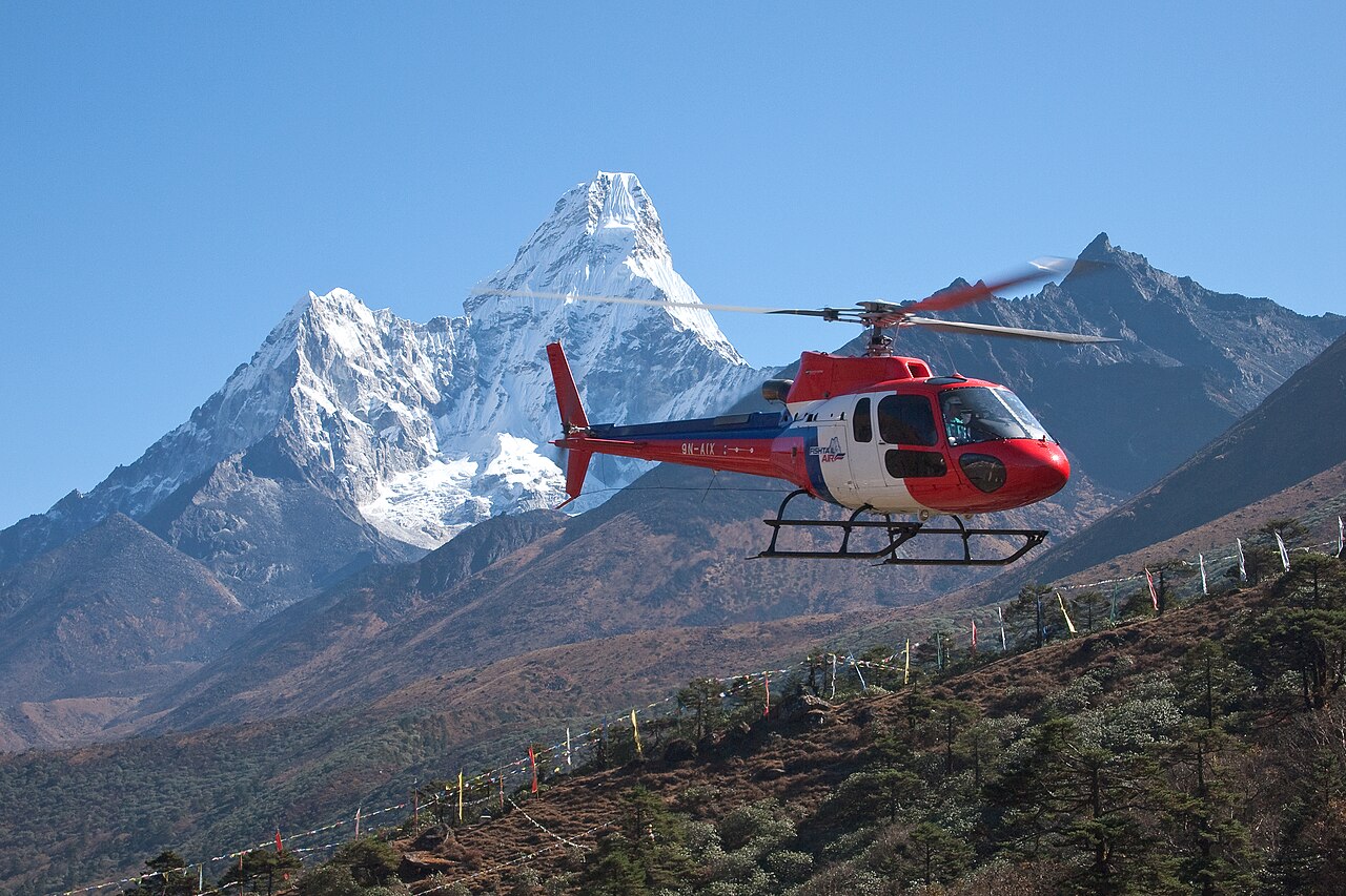 A helicopter above Tengboche